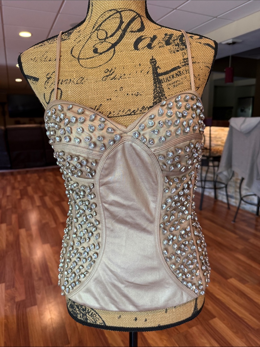 Size large Kimikal corset style top with large rhinestones w/  a tan satiny look